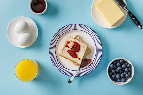 Top View Toasts Jam Orange Juice Boiled Eggs Butter Blueberries — Stock Photo, Image