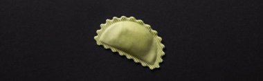panoramic shot of green ravioli isolated on black with copy space clipart