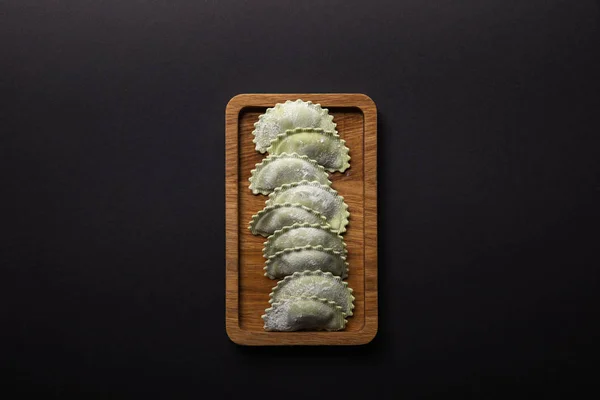Top View Raw Green Ravioli Flour Wooden Board Isolated Black — Stock Photo, Image
