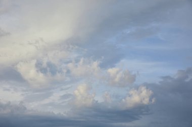 view of white and grey clouds on blue sunlight sky background 