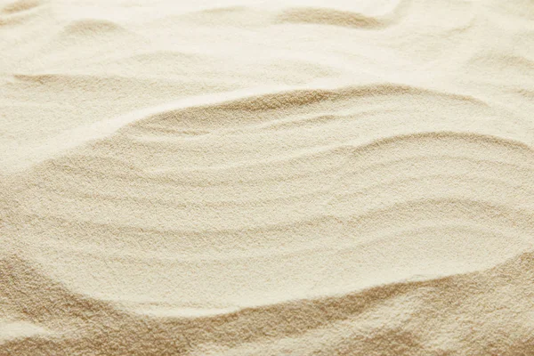 コピースペースを持つテクスチャ波状の黄金の砂の背景 — ストック写真