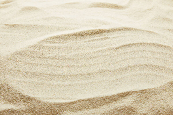textured wavy golden sand background with copy space