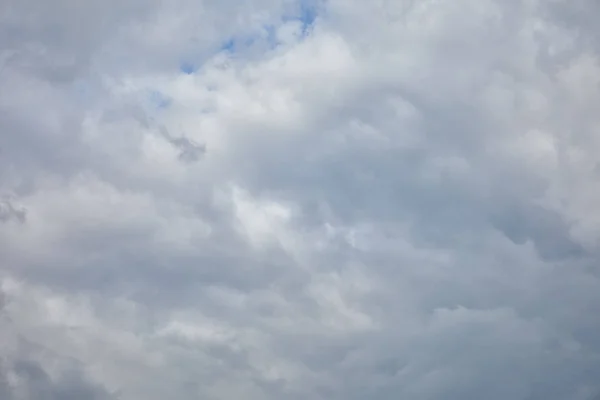 Dark sky with white clouds and copy space