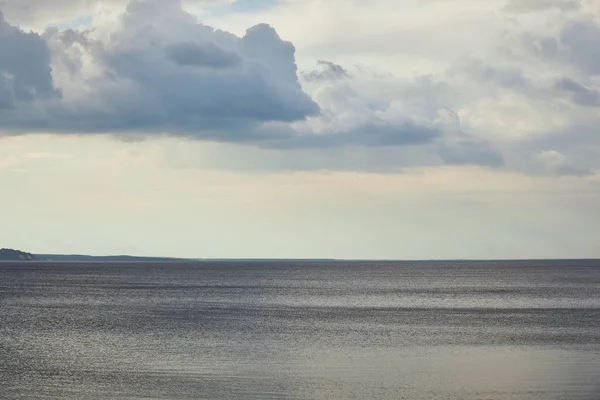 Overcast weather with dark clouds over river