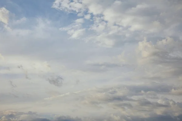 view of white and grey clouds on blue sky background 