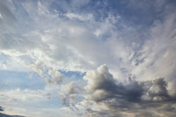 view of grey and white clouds on blue sunlight sky background 