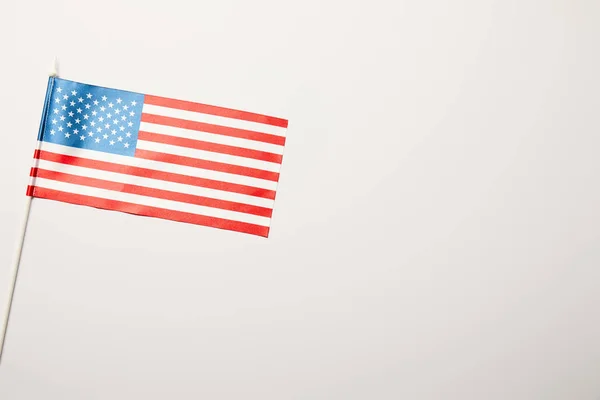 top view of american flag on stick white background with copy space