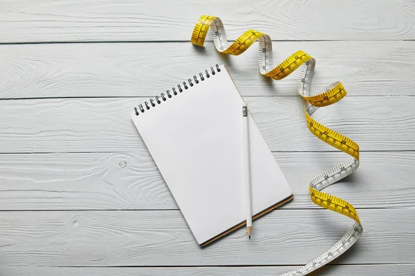 Top View Measuring Tape Notebook Pencil Wooden White Background — Stock Photo, Image