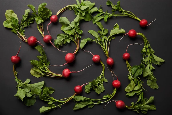 Top View Whole Nutritious Tasty Radish Green Leaves Black Background — Stock Photo, Image