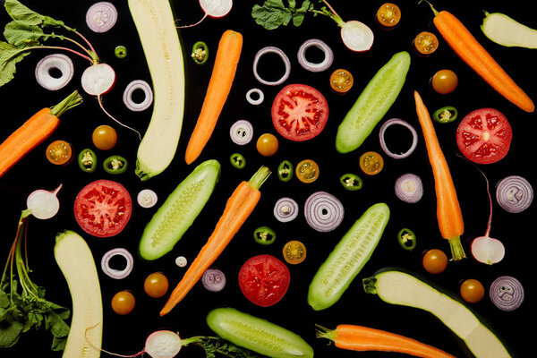 top view of delicious vegetable pattern background isolated on black