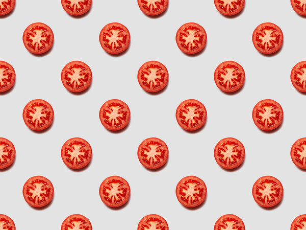top view of red tomato slices on white background, seamless pattern