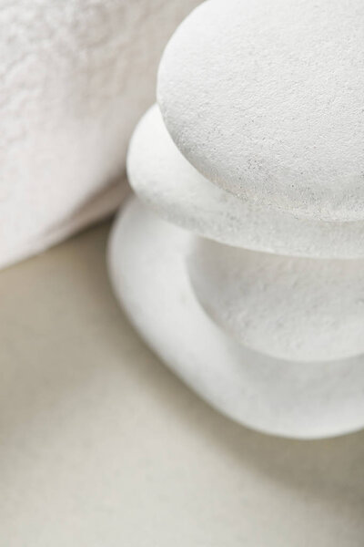 close up view of stones in stack near white cotton towel