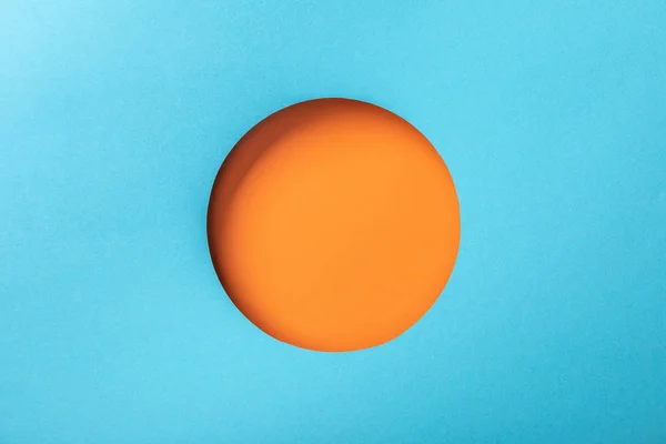 Creative Background Blue Paper Orange Hole — Stock Photo, Image