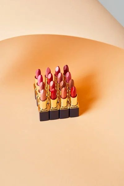 Different Red Shades Lipsticks Beige — Stock Photo, Image