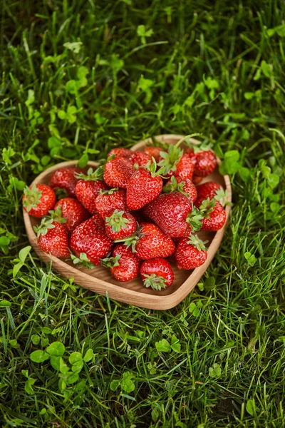 Fresh Strawberries Wooden Heart Shaped Plate Green Grass — Stock Photo, Image