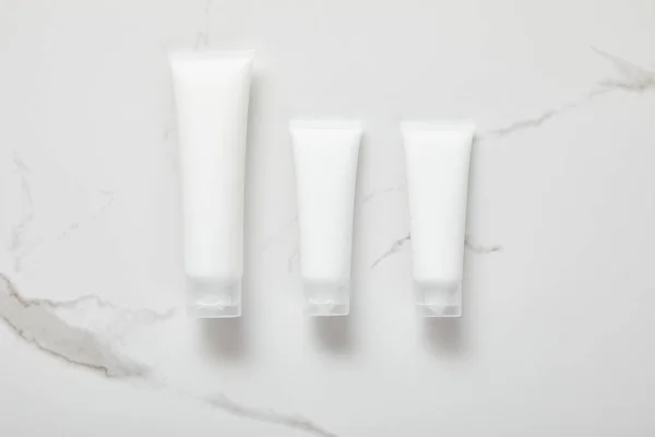 Top View Cosmetic Cream Tubes White Surface — Stock Photo, Image