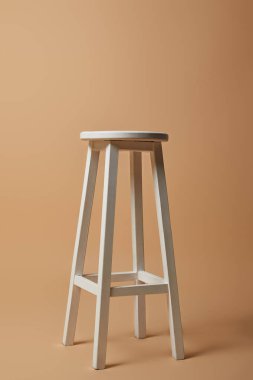 high white chair on beige background clipart