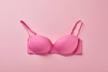 top view of brassiere on pink background, breast cancer concept clipart