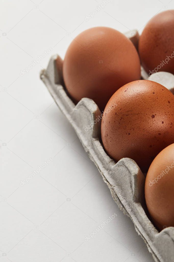 selective focus of chicken eggs in carton box
