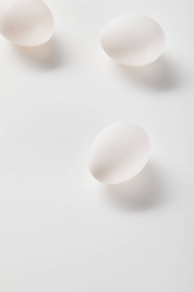  top view of chicken eggs on white surface