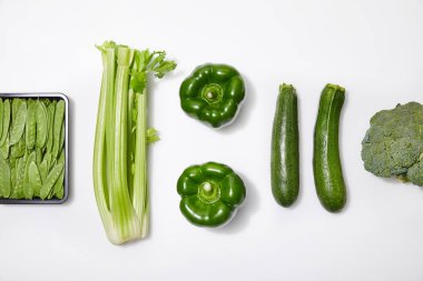 top view of green vegetables on white background clipart
