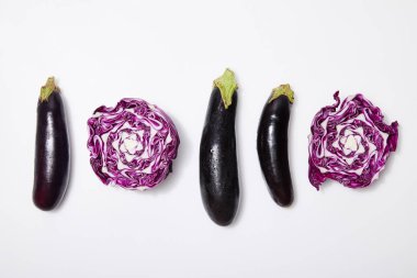 top view of red cabbage and eggplants on white background clipart