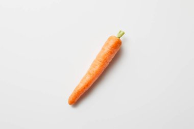 top view of organic carrot on white background clipart