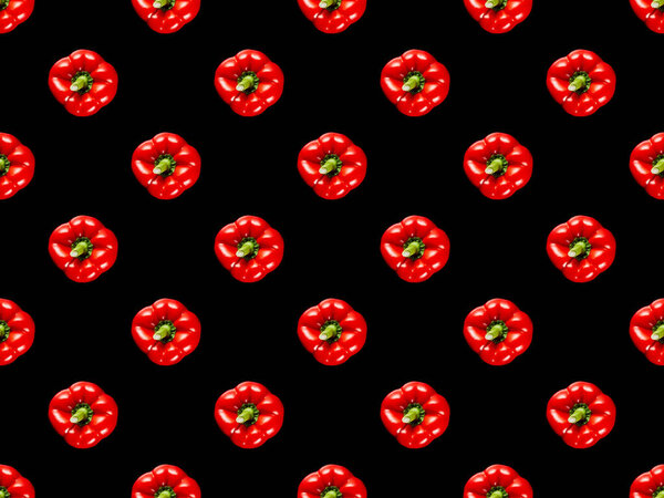red organic whole bell peppers isolated on black, seamless background pattern