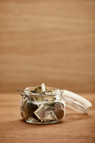 Opened Glass Jar Dollar Banknotes Coins Wooden Table — Stock Photo, Image