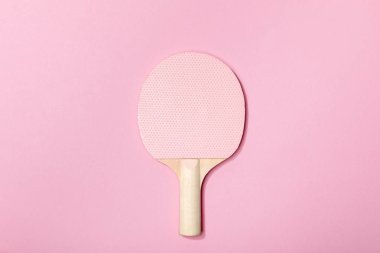 top view of table tennis pink wooden racket on pink background clipart