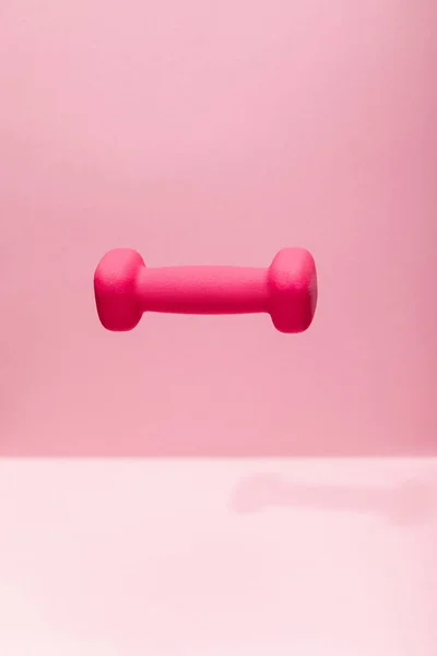 Pink Bright Dumbbell Levitating Air Pink Background — Stock Photo, Image