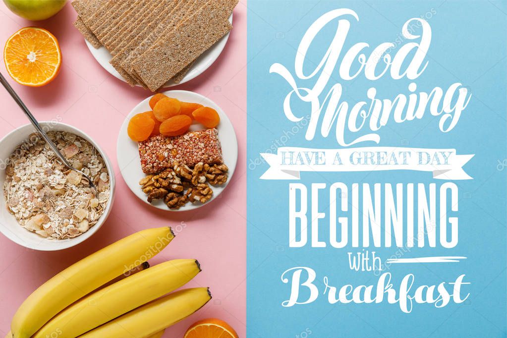 top view of fresh fruits, crispbread and breakfast cereal on blue and pink background with good morning, have a great day beginning with breakfast lettering