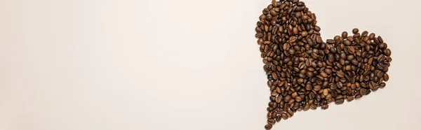 Top View Heart Made Coffee Grains Beige Background Panoramic Shot — Stock Photo, Image