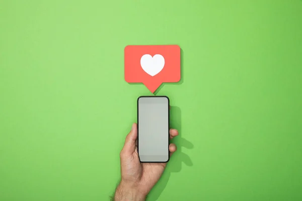 Cropped View Man Holding Smartphone Heart Red Icon Gadget Green — Stock Photo, Image