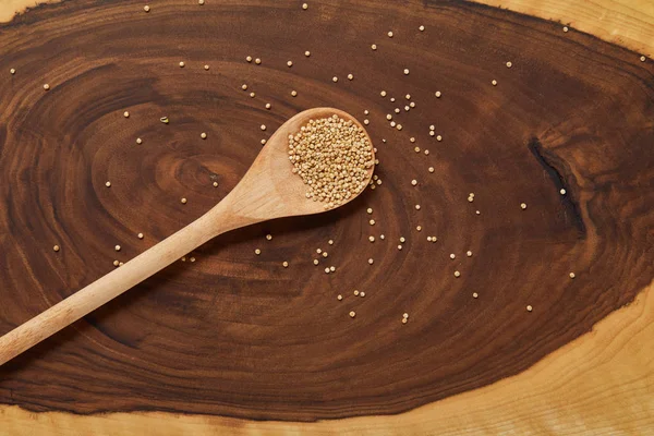 Top View White Quinoa Wooden Spoon Beige Brown Table — Stock Photo, Image