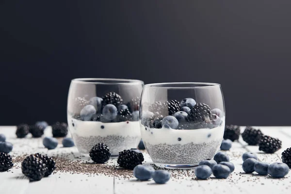 Selective Focus Yogurt Chia Seeds Berries Glasses Scattered Seeds Blueberries — Stock Photo, Image