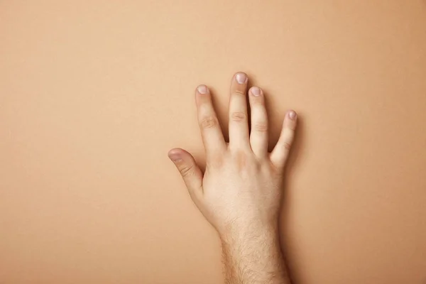 Partial View Male Hand Beige Background Copy Space — Stock Photo, Image
