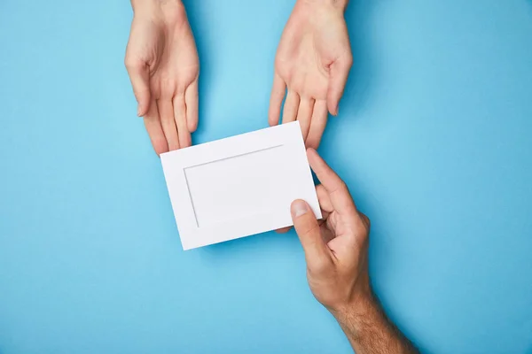 Cropped View Man Giving White Empty Card Frame Woman Blue — Stock Photo, Image