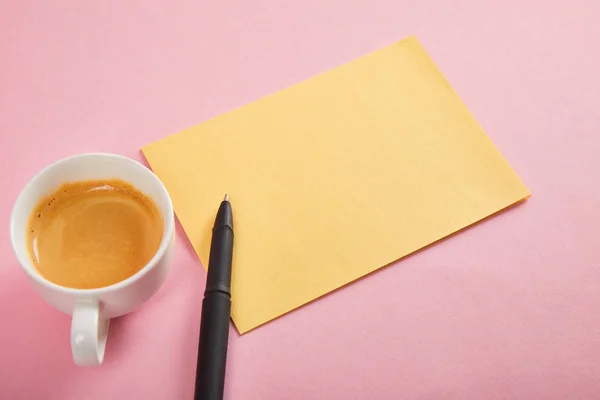 Yellow Envelope Pen Coffee Cup Pink Background — Stock Photo, Image