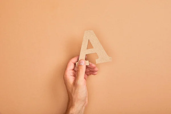Partial View Man Holding Paper Cut Letter Beige Background — Stock Photo, Image