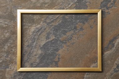 empty golden frame on stone background with copy space clipart
