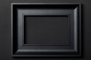 top view of empty black frame on black background with copy space clipart