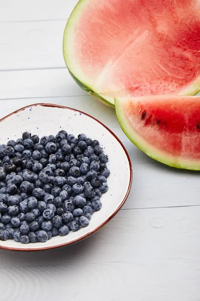 Cut Ripe Red Watermelon Seeds Plate Blueberries Wooden White Table — Stock Photo, Image