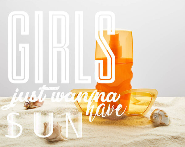 yellow stylish sunglasses and sunscreen in orange bottle on sand with seashells on grey background with girls just wanna have sun illustration