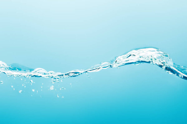 transparent pure water wave with drops on blue background