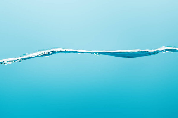 transparent pure water on blue background