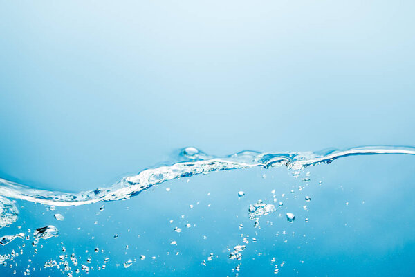 transparent water wave with underwater bubbles on blue background