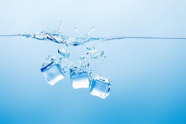 transparent pure water with splash and ice on blue background clipart