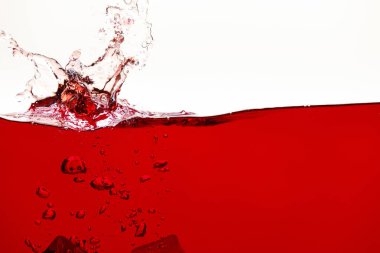 red bright liquid with splash and bubbles isolated on white clipart