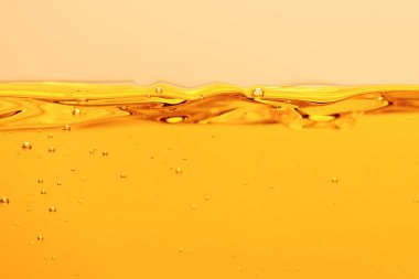 ripple yellow bright liquid with bubbles isolated on yellow clipart